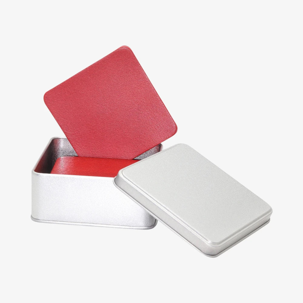 Genuine leather coasters for office desk with a red interior lid on a white background