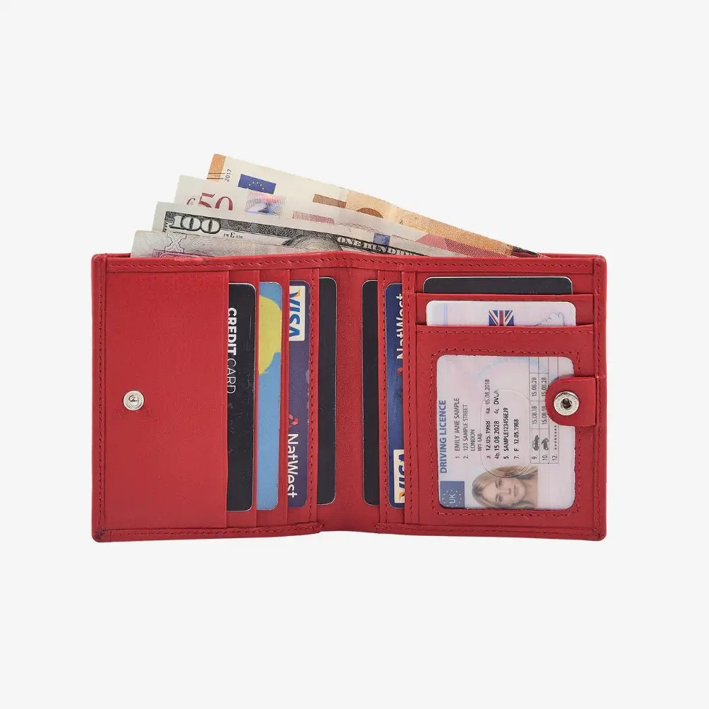 Red wallet with money and cards on a white background
