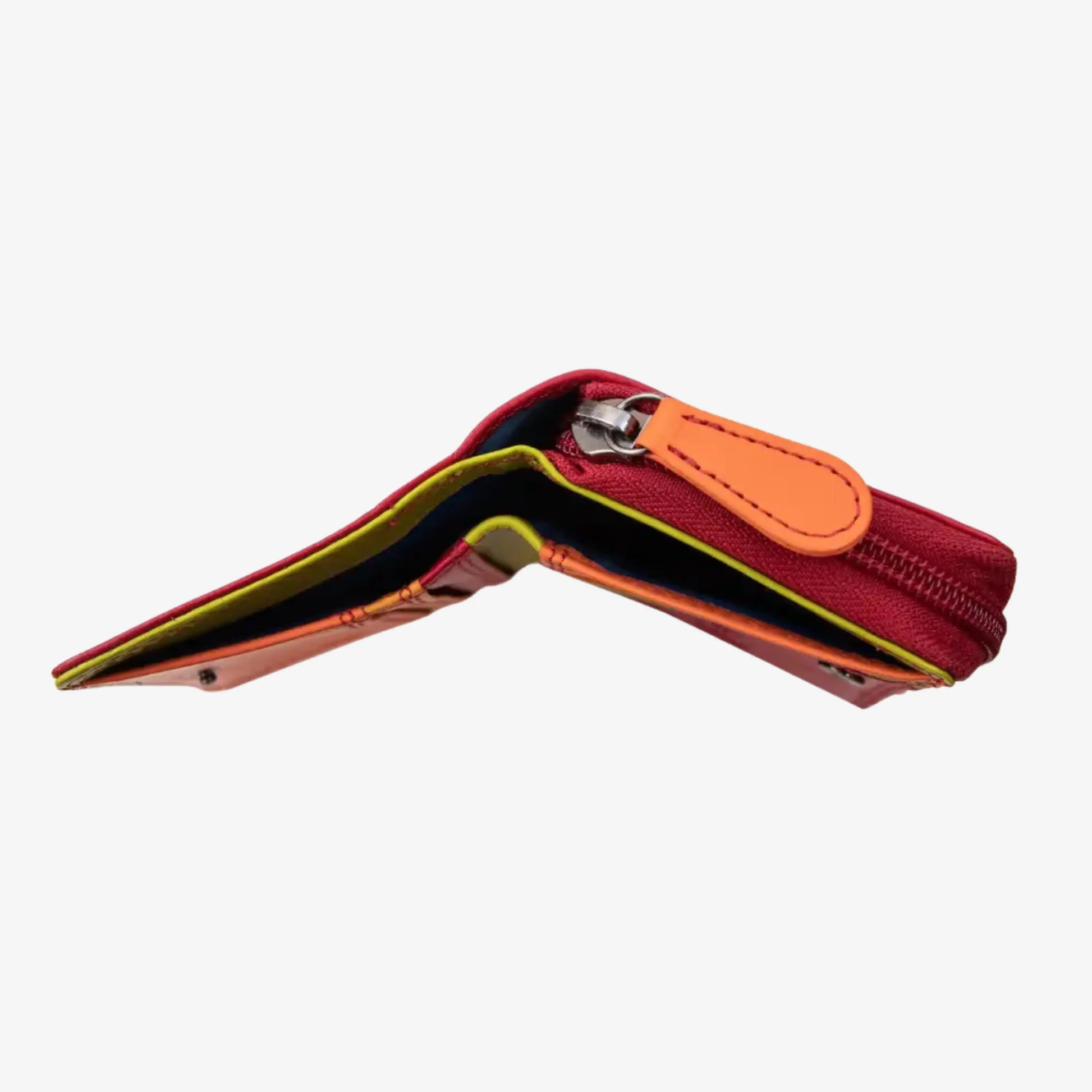 A red zippered wallet shown open, featuring a bright orange leather strap closure and a yellow-green inner lining, photographed on a light gray background.