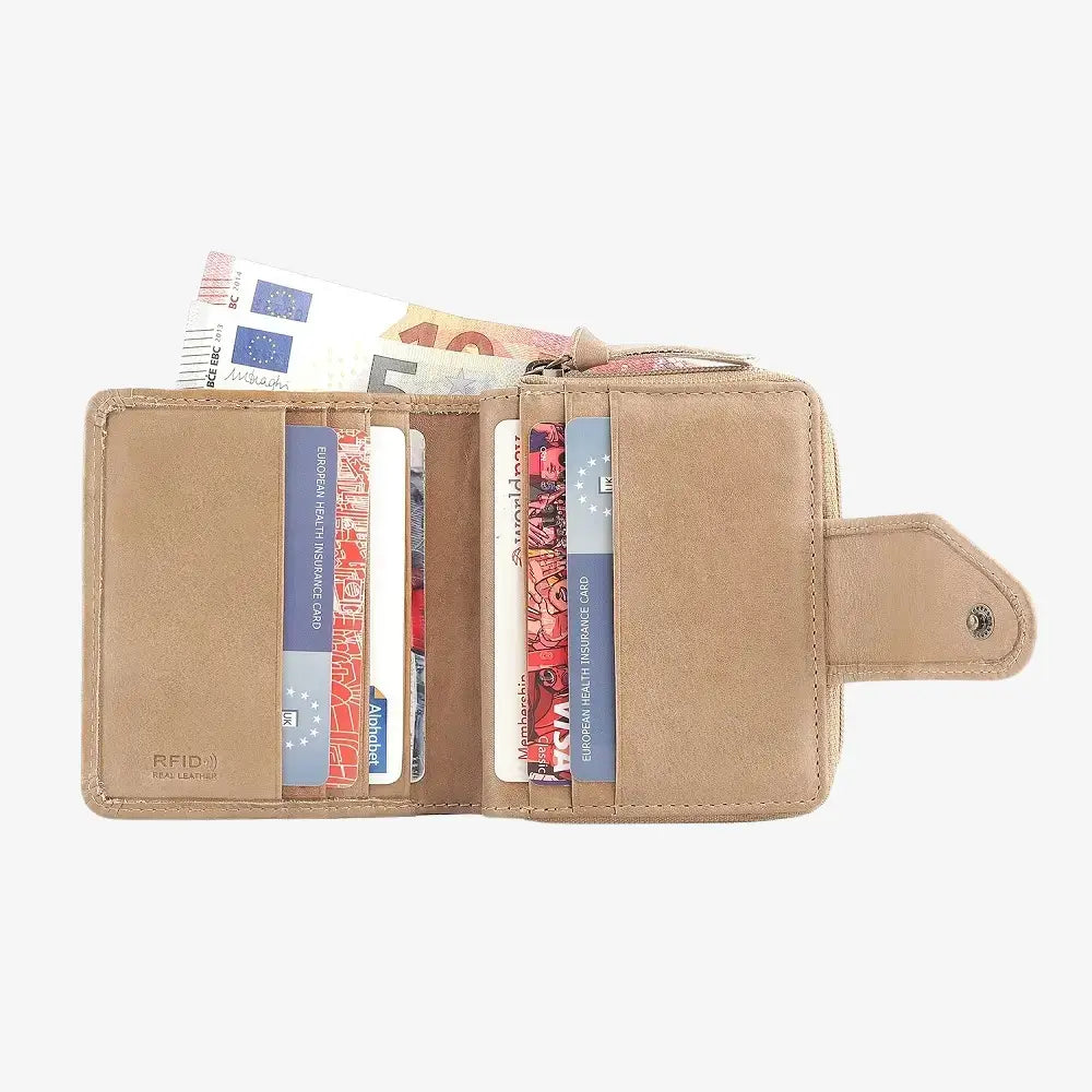 sand wallet with cards and money on a white background
