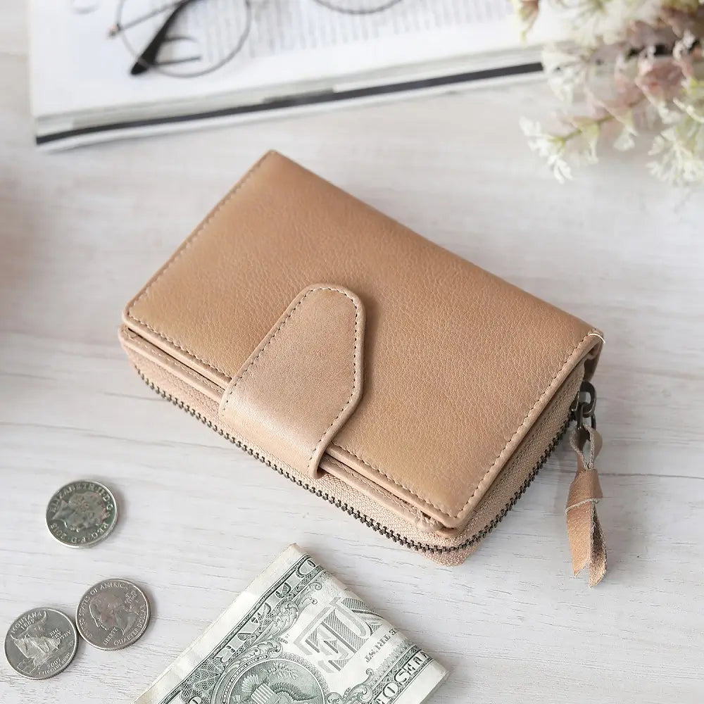 Flat lay of Sand Renata bifold purse in washed Cancun leather showing full layout