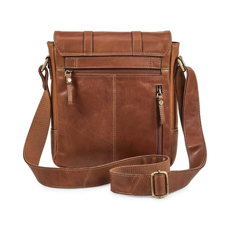 Brown leather crossbody bag with a strap on a white background