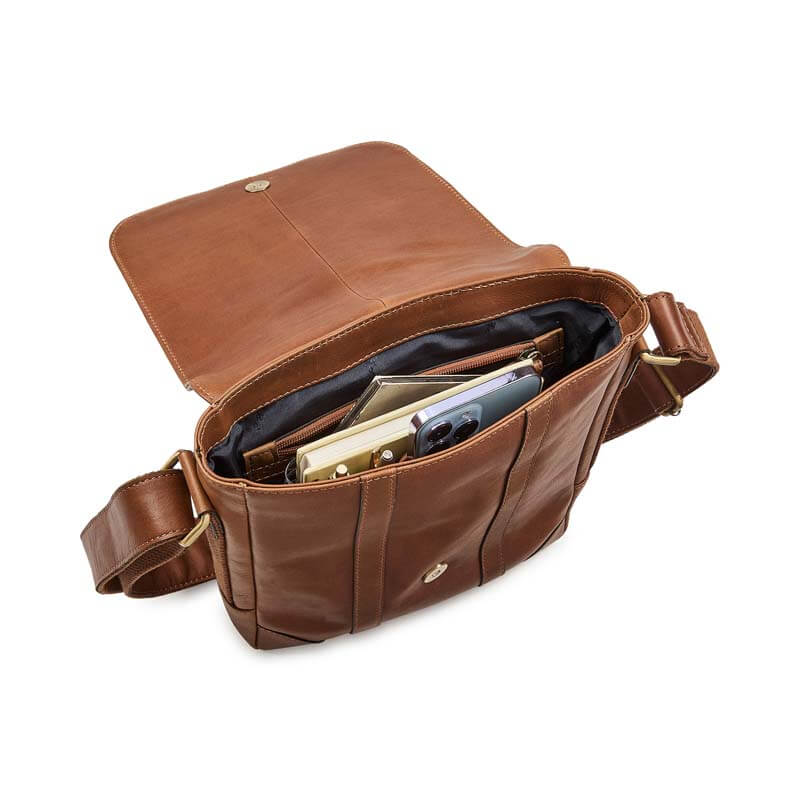 Brown leather bag with compartments on a white background