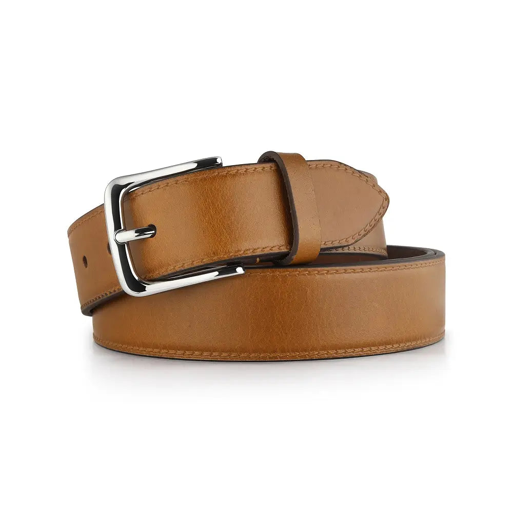 Tan leather belt with a silver buckle on a white background