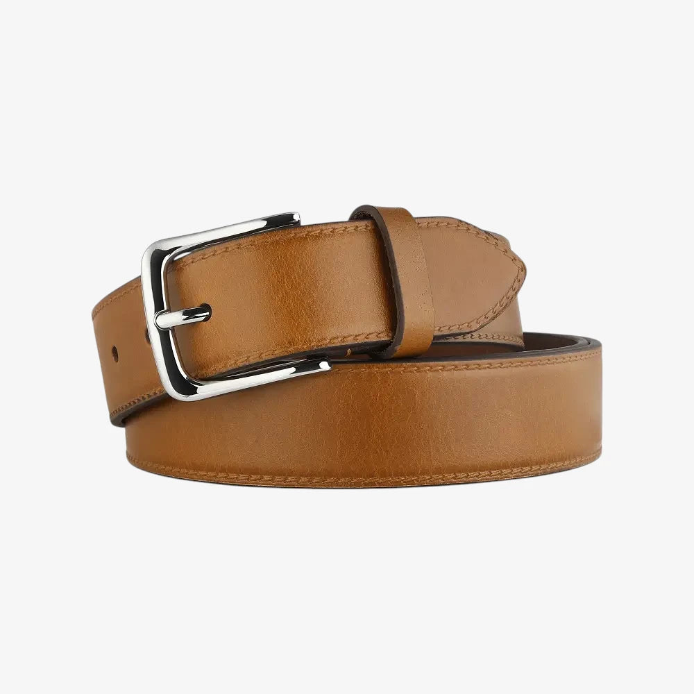 Cognac leather belt with a silver buckle on a white background