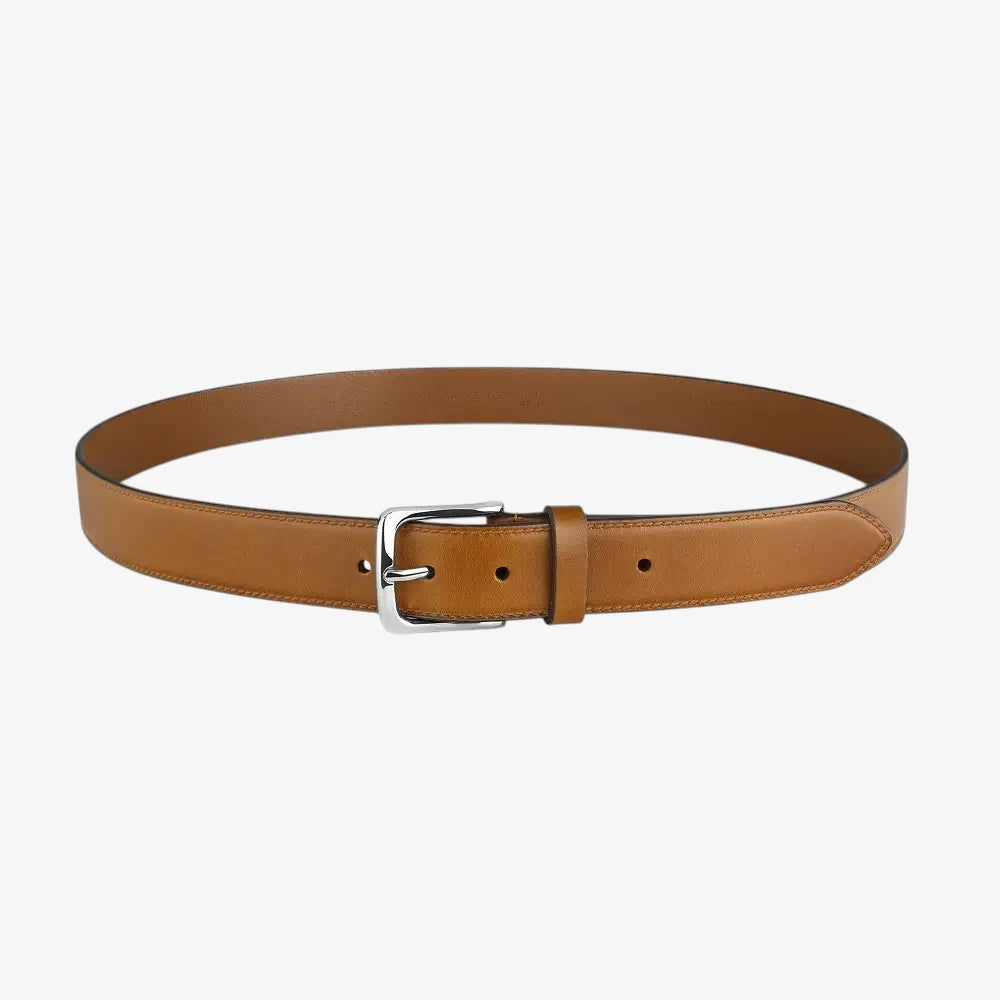 Full length view of Cognac leather belt with a silver buckle on a white background
