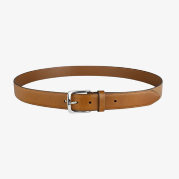 Full length view of Cognac leather belt with a silver buckle on a white background