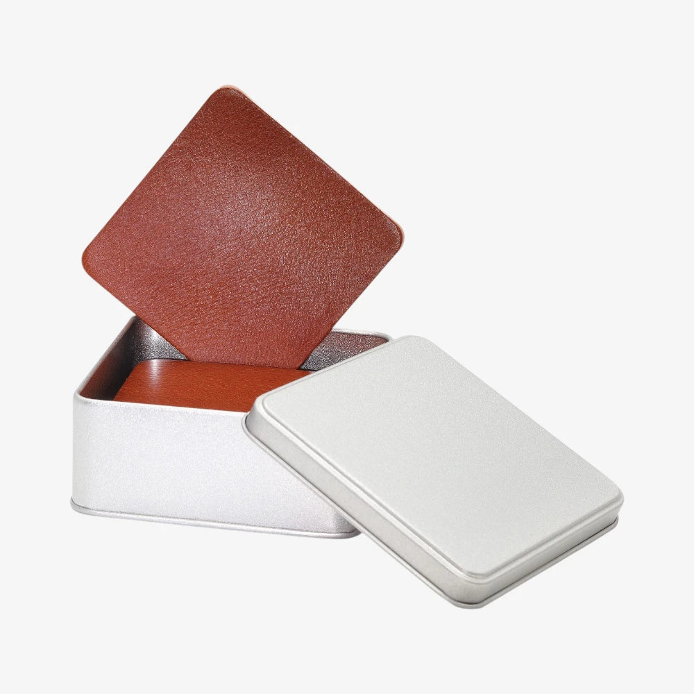  Heat resistant tan leather coaster set  on a white background