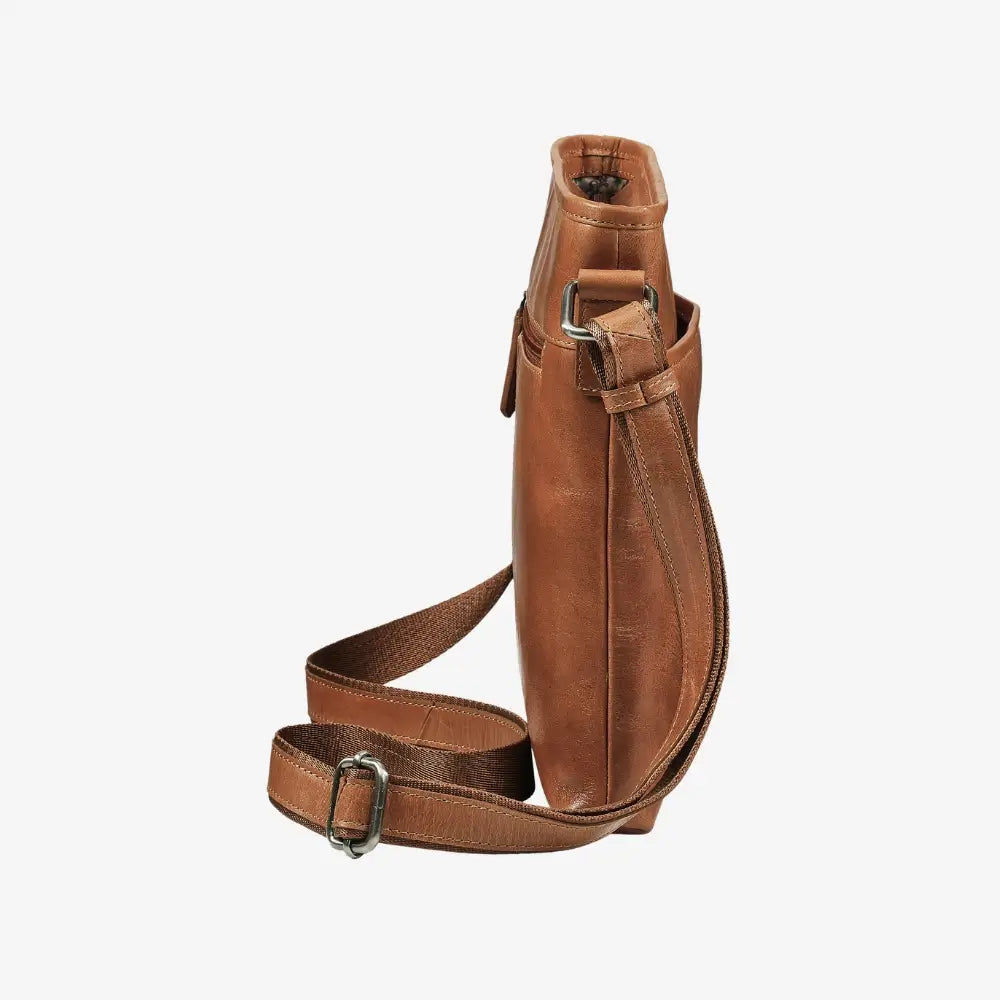 Large tan leather handbag with adjustable crossbody strap