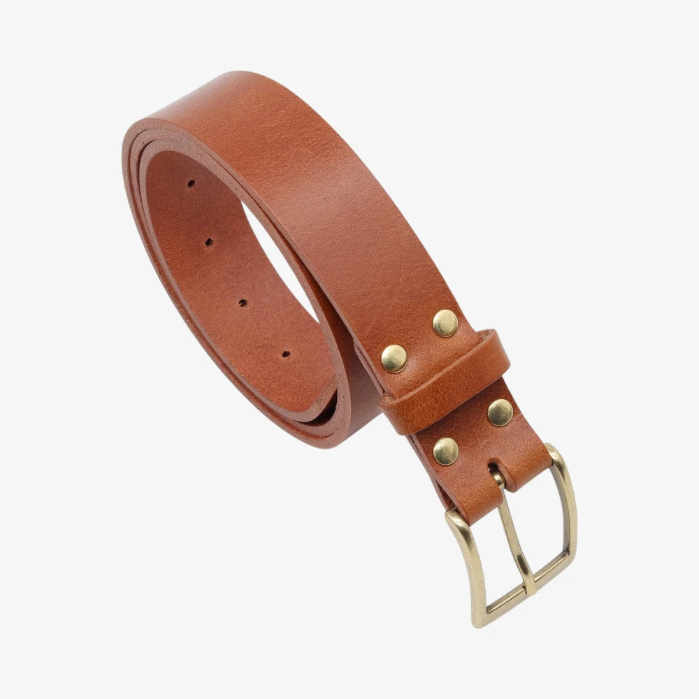 Tan  leather belt with gold buckle on a white background