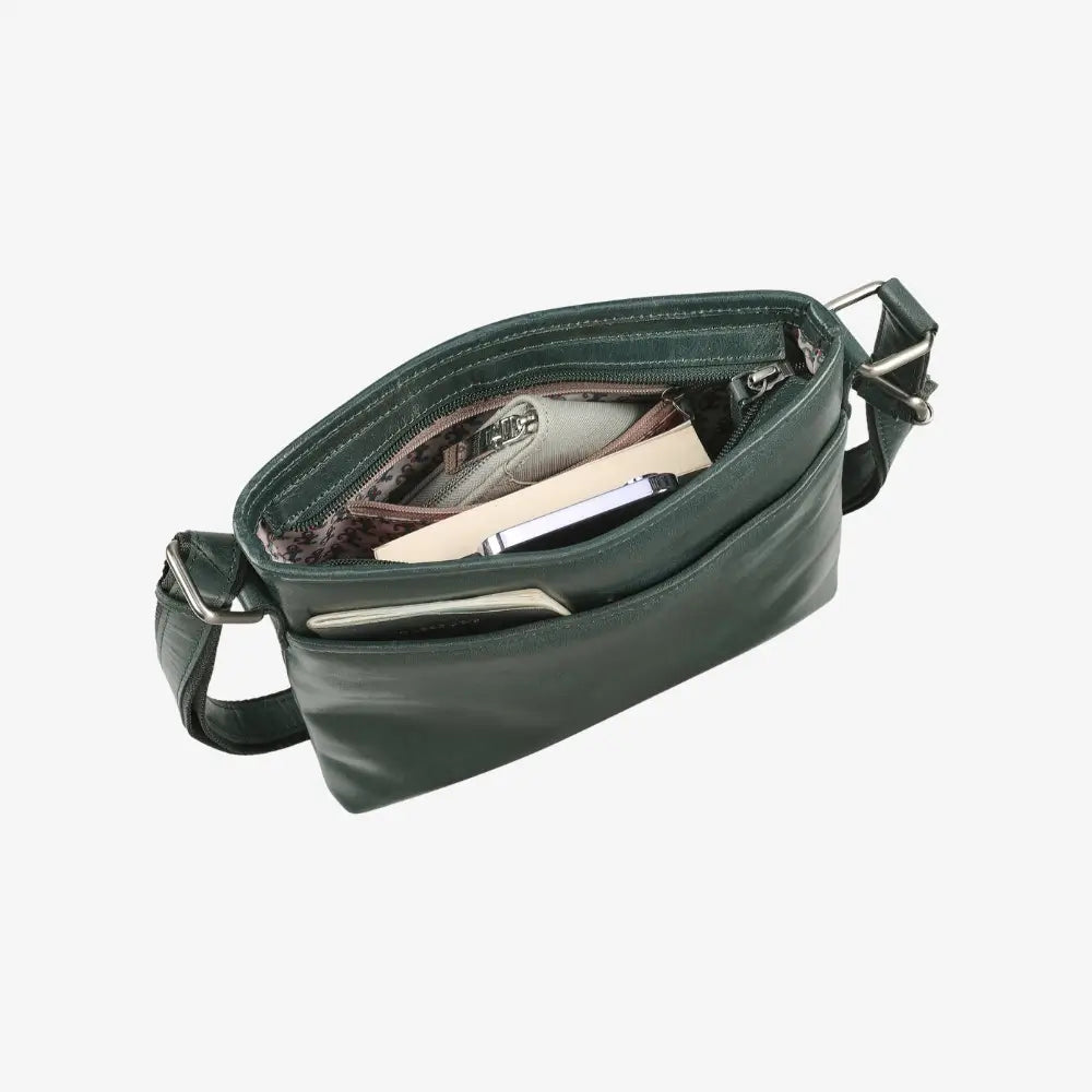 Teal leather bag with sunglasses inside on a white background