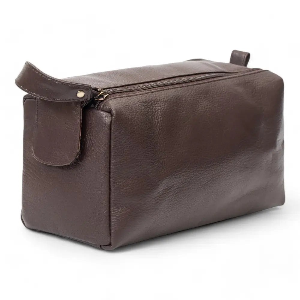 Brown leather toiletry bag on a white background