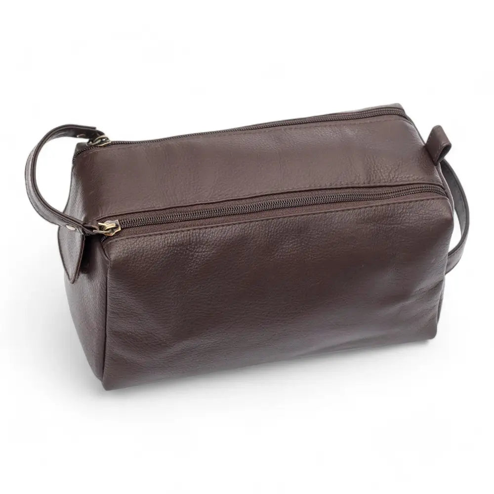 Brown leather duffel bag with a zipper on a white background
