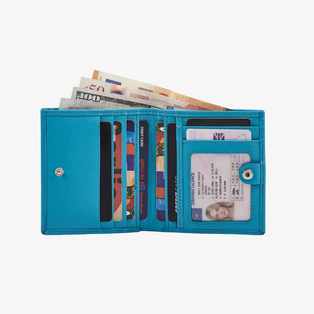 Turquoise wallet open to show cards and money on a white background