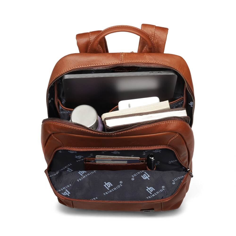 Person wearing Tan leather backpack Morgan Tuscan Bag