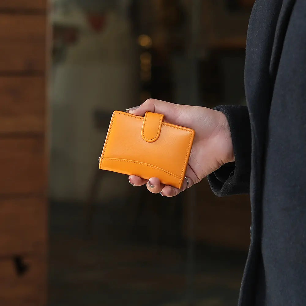 This soft leather credit card holder in yellow is perfect for women who value both style and practicality