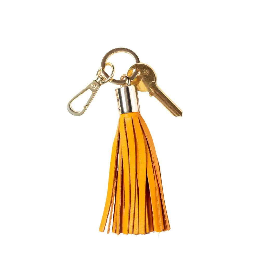 Keychain with Yellow tassel and gold accents on a white background