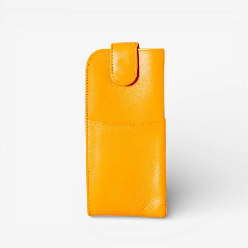 Yellow leather pouch on a light gray background
