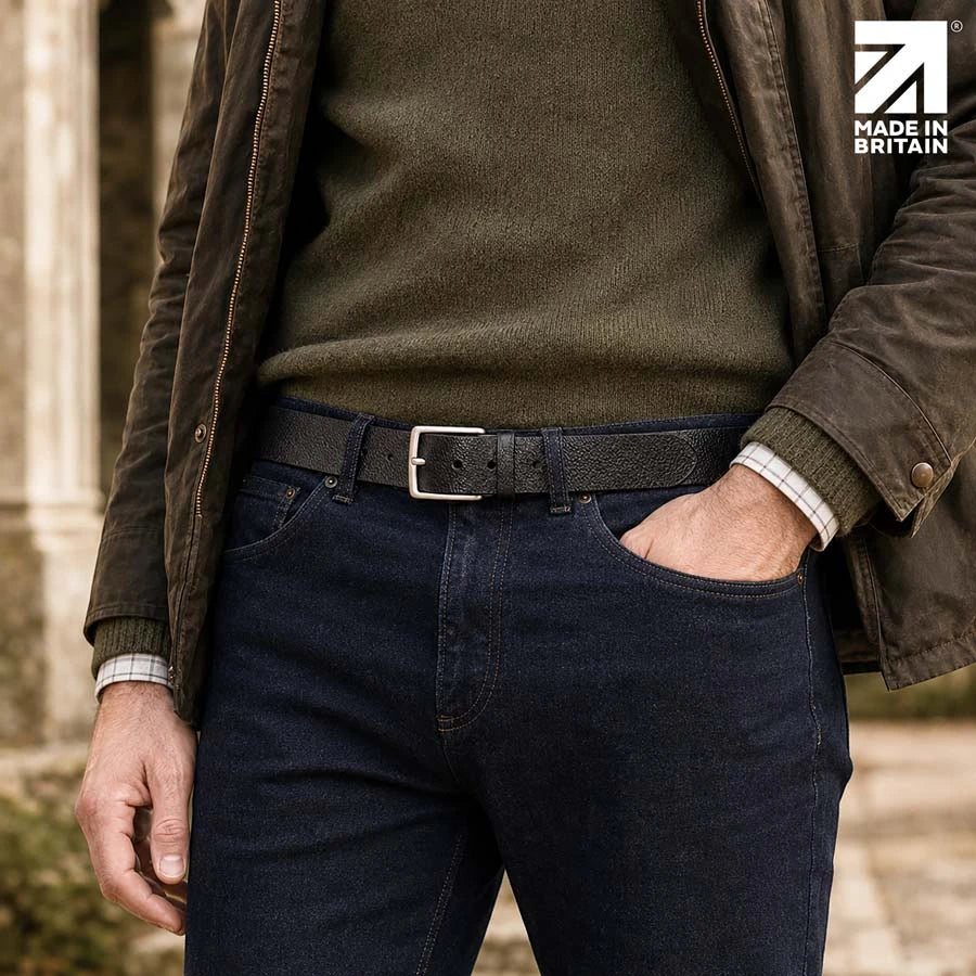 Men’s black 40mm pebble grain leather belt worn with dark denim