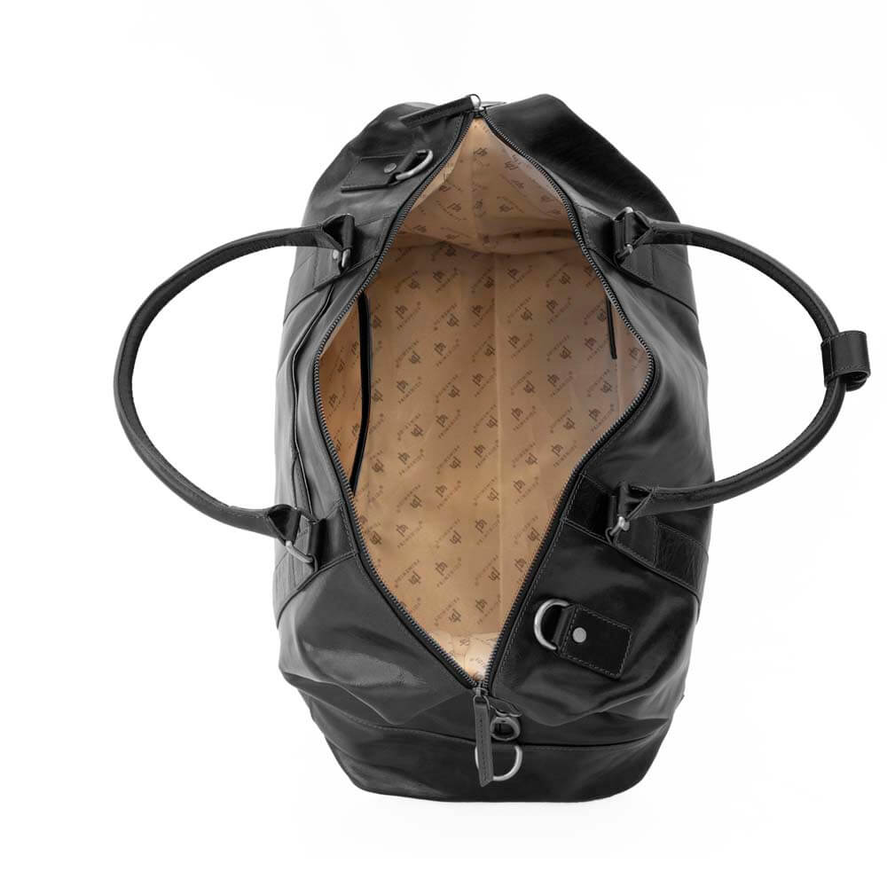 Interior view of the Orion large black leather holdall travel bag by Primehide, showing spacious lined compartment and pockets.