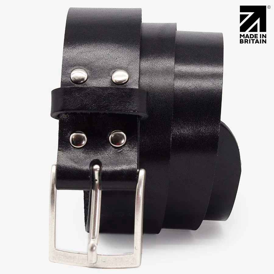 Close-up of the polished nickel buckle on a black full-grain Italian leather belt