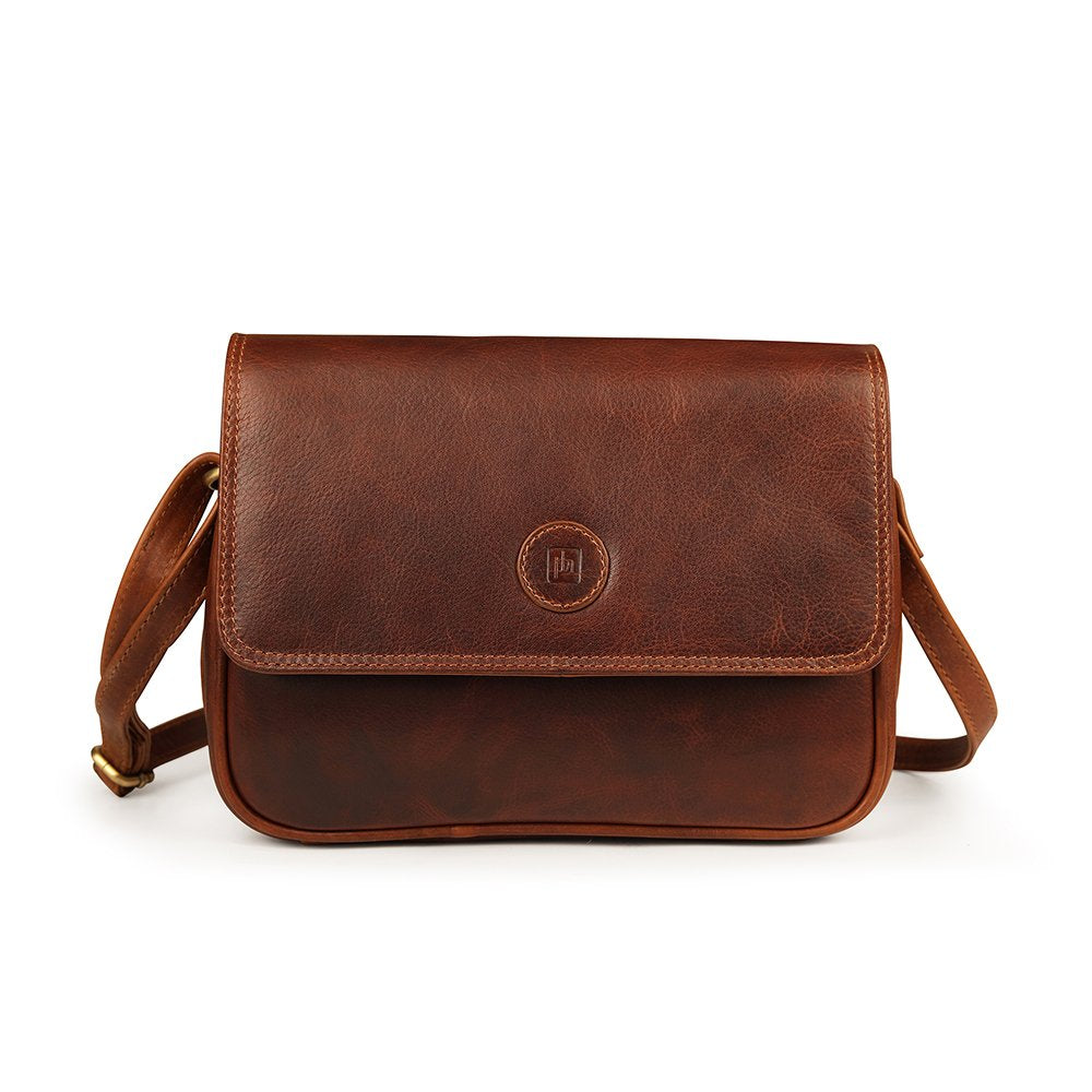 Front view of Orion brown leather handbag by Primehide with back zip pocket.