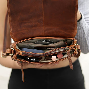 Inside view of Orion brown leather handbag with flap open, showing organised compartments.