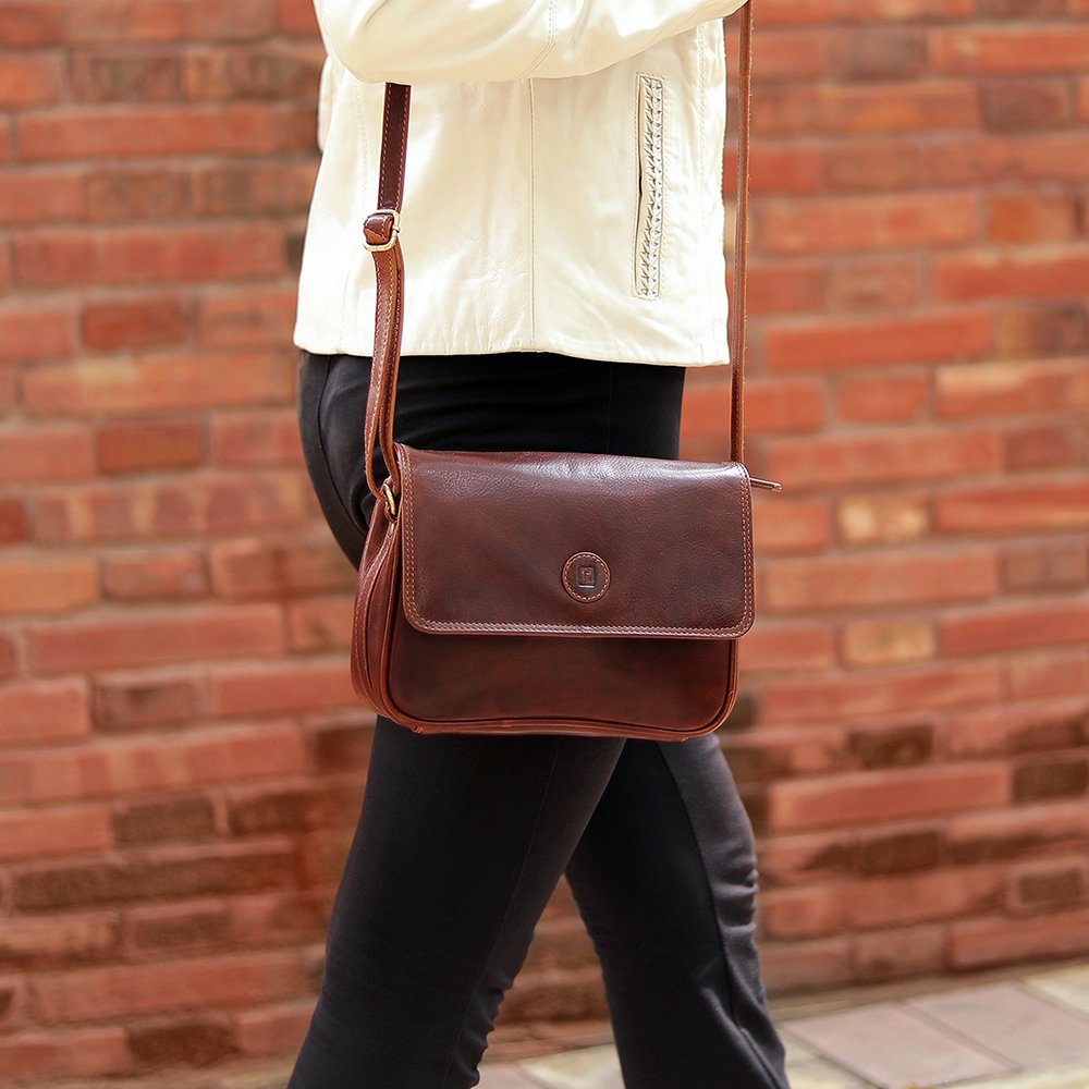 Woman wearing Orion brown leather handbag crossbody style by Primehide.