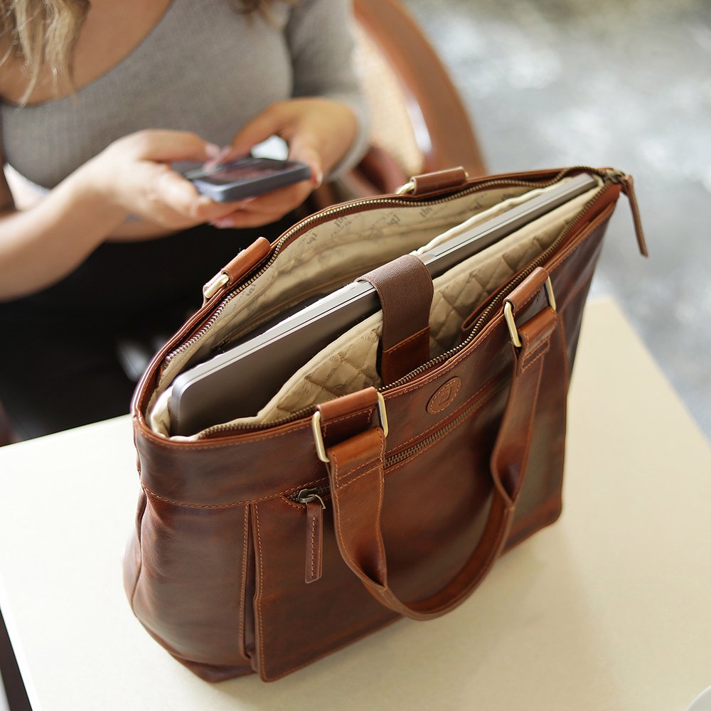 Inside of Orion women’s leather laptop tote bag showing removable laptop sleeve and lining.