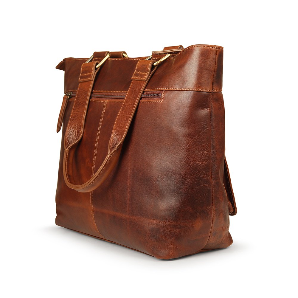 Close-up of full-grain leather and brass fittings on Orion laptop tote bag.