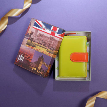 Passport holder with Union Jack design and green wallet with orange accent on a purple background