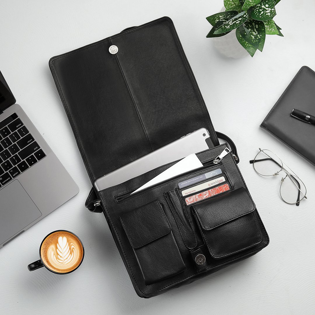 black leather organizer bag shown open, highlighting its practical interior with dedicated slots for cards, a tablet, and various pockets, perfect for keeping items neatly organised.