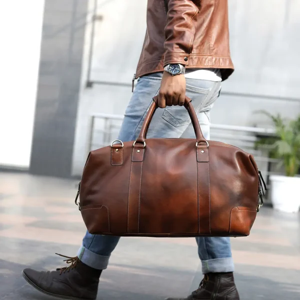 A model carrying the vintage leather holdall, showcasing its stylish appearance for on-the-go use.