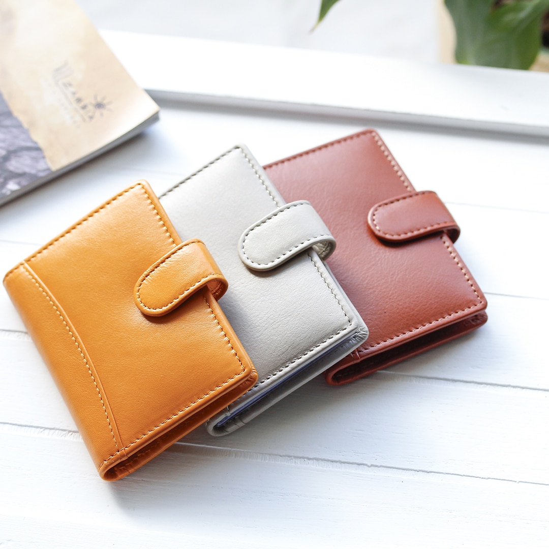 leather credit card wallets for women with detailed stitching and a tab closure