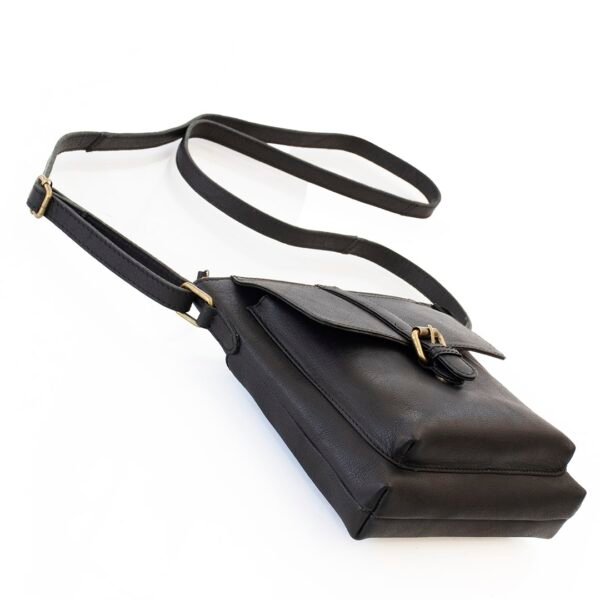 Bottom angled view of a squared rectangle black leather crossbody bag with a long shoulder strap, ideal for stylish functionality